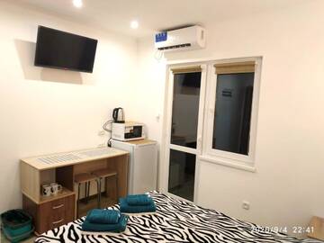 Фото номера Двухместный номер с 1 кроватью и балконом Апартаменты Guesthouse Dmitrieva г. Ялта 3