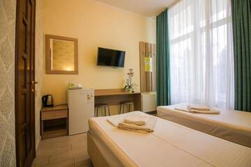 Фото номера Стандартные апартаменты Апартаменты Guesthouse Dmitrieva г. Ялта 2